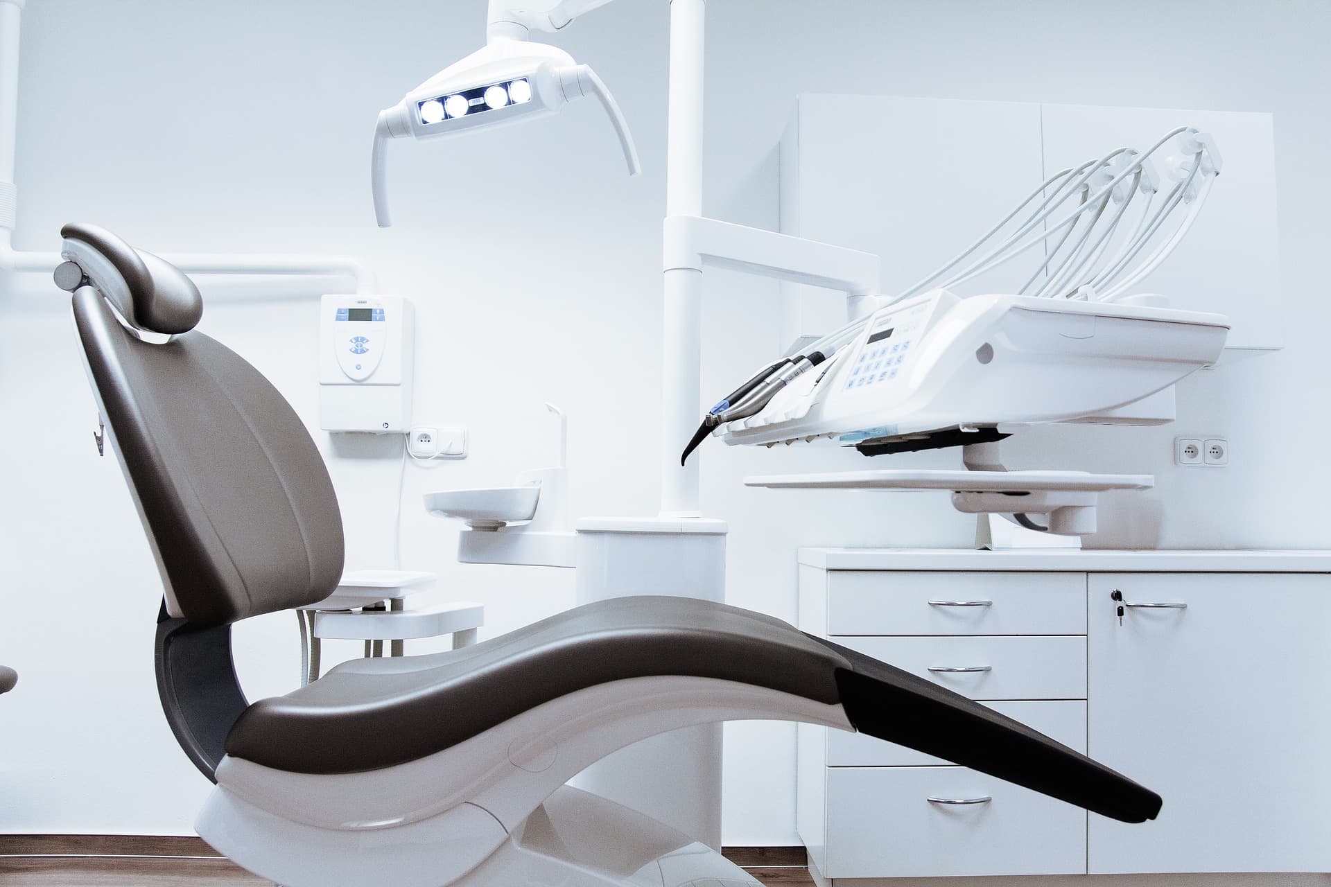 Modern dental treatment chair in a clean, well-equipped operatory